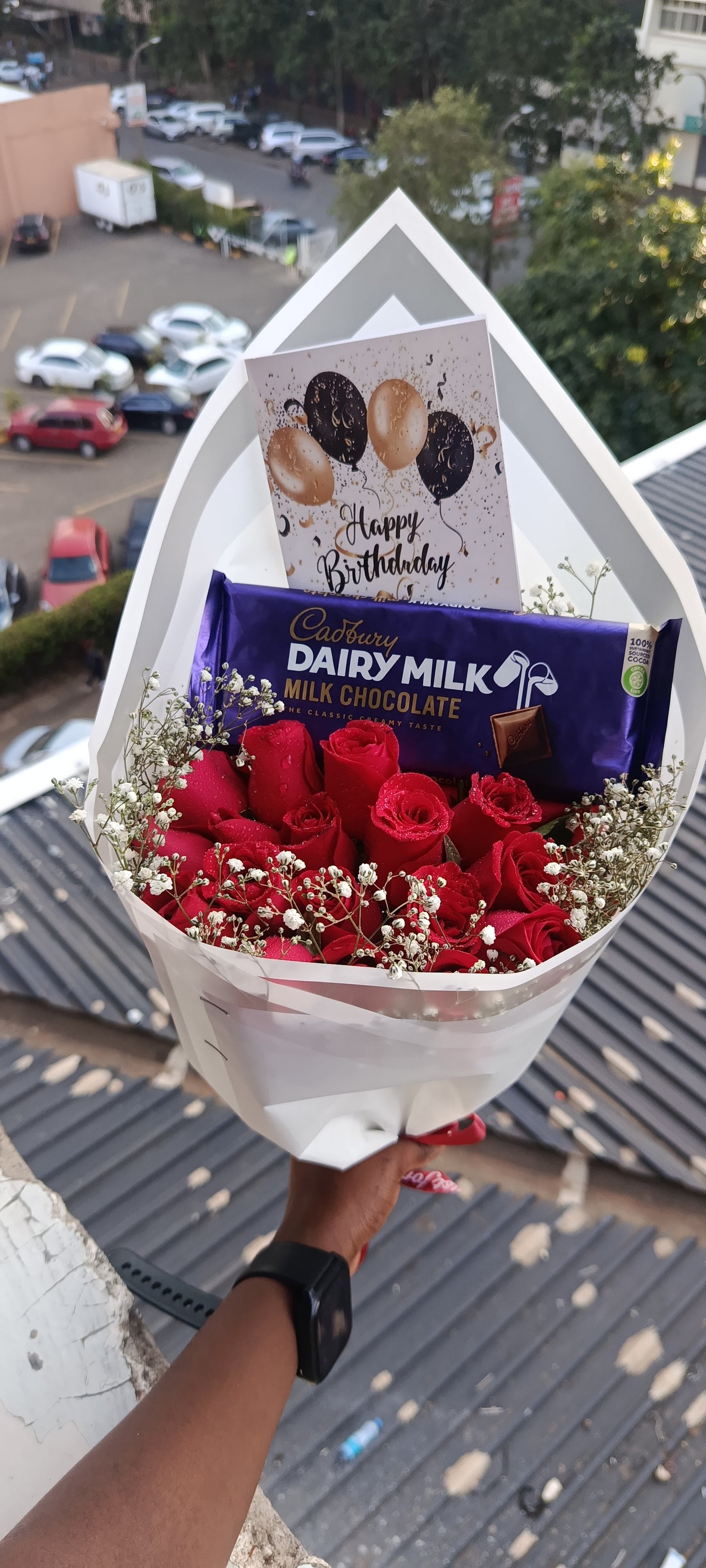 RED ROSES WITH A LARGE CADBURY CHOCOLATE
